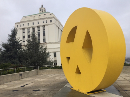 View from the Oakland Museum of California scultpure garden. Big Peace by Tony Labat foregrounds the Alameda County Courthouse, an historic Black Panther Party site. Free Huey Rallies were held at the Courthouse in 1968, a year before the Museum opened.