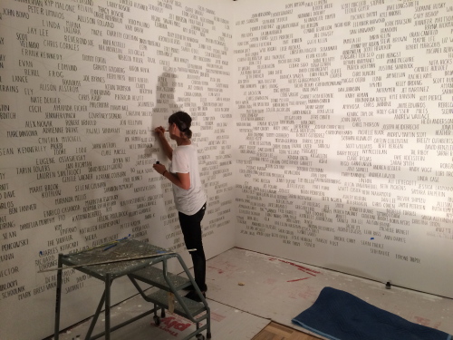 Amanda Eicher installing Geneology: Adobe Books, a relationship map of San Francisco’s Mission Distict artist community of the 1990s.